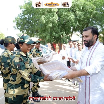 Manoj Goel distributing Khadi to BSF women jawans